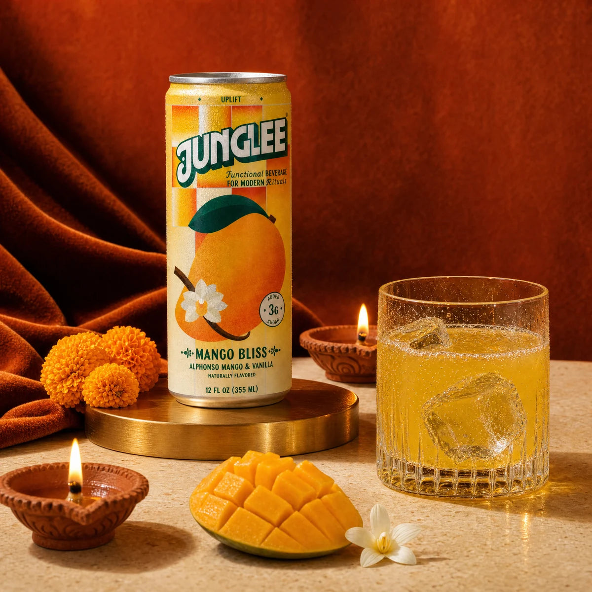 Mango Bliss with a golden drink, orange velvet, marigolds and glowing Diwali diyas